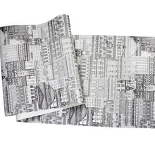 Load image into Gallery viewer, Sheet of cityscape patterned vinyl wallpaper printed in black and white