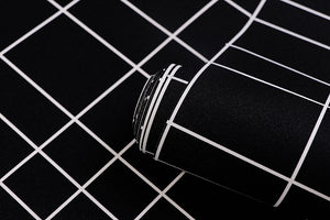 Detail of black grid patterned vinyl wallpaper