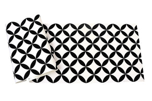 Black and white circle and diamond patterned vinyl wallpaper sheet