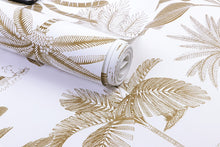 Load image into Gallery viewer, Detail of tropical designed non woven wallpaper illustrated with gold palm trees on a white background
