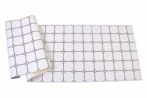 Sheet of black and white grid patterned vinyl wallpaper with flower motif