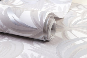 Detail of white and silver rainforest foliage patterned non woven wallpaper