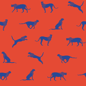 Sitting, pouncing, and running leopard patterned vinyl wallpaper in red and blue