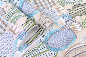 Detail of pottery printed non woven wallpaper in shades of green and turquoise