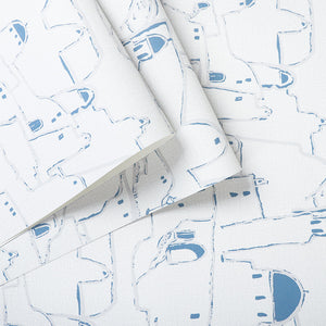 Detail of blue and white Greek town printed vinyl wallpaper