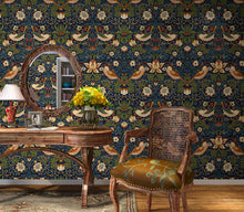 Load image into Gallery viewer, &#39;The Strawberry Thief&#39; wallpaper designed by William Morris in blue vinyl decorating a bedroom
