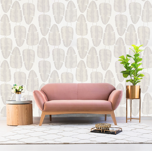 Tropical banana leaf patterned non woven wallpaper decorating a living room wall