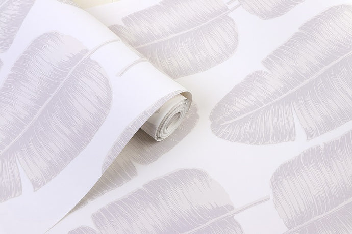 Detail of tropical banana leaf patterned non woven wallpaper in white and grey tones