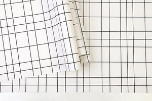 Detail of white grid pattered vinyl wallpaper